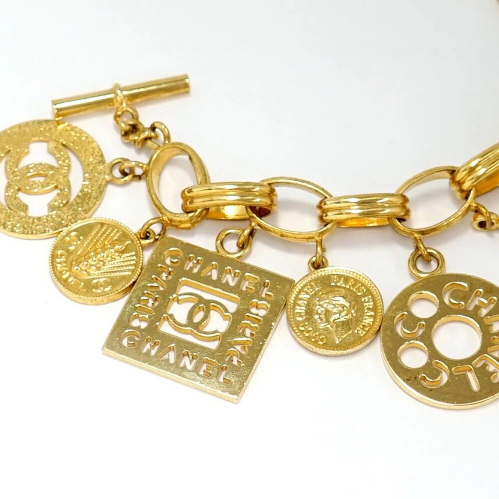 CHANEL CC Coco PARIS Multi Charm Toggle Bracelet 7" Gold Tone 93A Auth w/Box - Picture 2 of 7